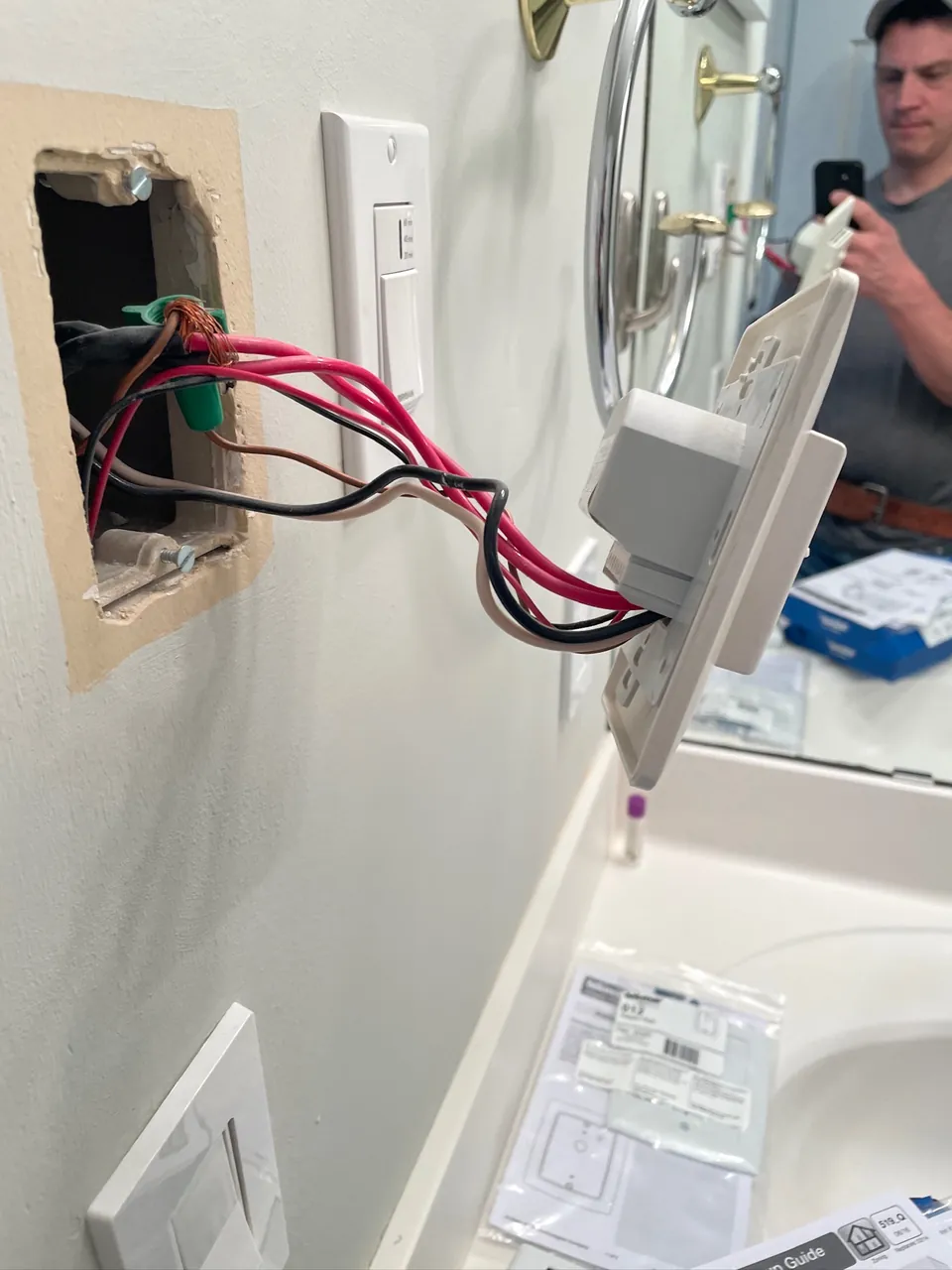 Outlet and switch boxes wired during a bathroom remodel